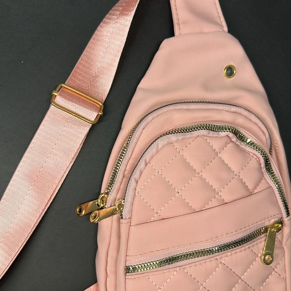 Pink Cross Body Backpack with gold zipper pockets